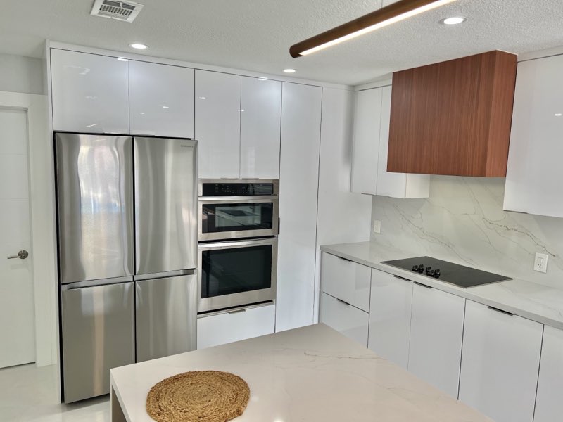Custom cabinetry with a wood range hood