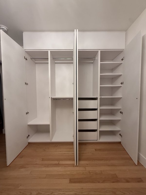 Custom walk-in closet system with shelving and drawers